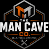 A centered hexagonal logo on a black background reading 'THE MAN CAVE CO.' with the tagline 'GEAR.